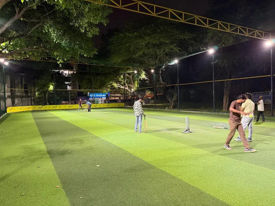 A batter facing up during a floodlit fixture